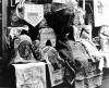 Paris shops decorated their windows with souvenirs made by the Belgians from the sacks of flour sent to them by the Belgian Relief Committee. These souvenirs were sold to raise money to help the Belgian people. ca. 1919