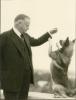 Former President Herbert Hoover playing with Weegie in his Palo Alto home. 1936