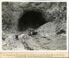 The concrete arch coffer dams are being blasted out of the lower portals of diversion tunnels, shown here Tunnel #2.05/15/1932