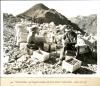 Workers called "powder monkeys" load dynamite cartridges with electric primers at isolated points. 08/15/1932