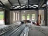 Interior view of new expanded lobby area with new concrete floor, August 6, 2025