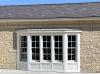Exterior view of new bay window with trim work completed, May 6, 2026