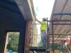 Worker attaching limestone to Museum façade