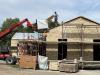 Work crew installing roof insulation, July 2, 2025