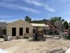 Work crew installing roof insulation, July 2, 2025