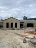 Museum exterior showing future windows and front entrance, July 22, 2025