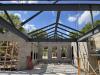 Trusses supporting roof beam for new lobby area