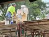 Worker saws limestone into brick-size pieces for Museum façade