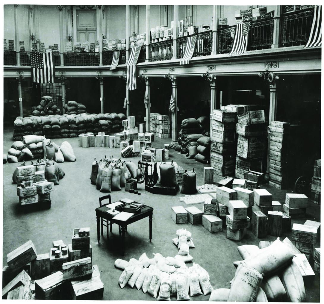 In Brussels sacks of white flour and condensed milk are ready for distribution. ca. 1916