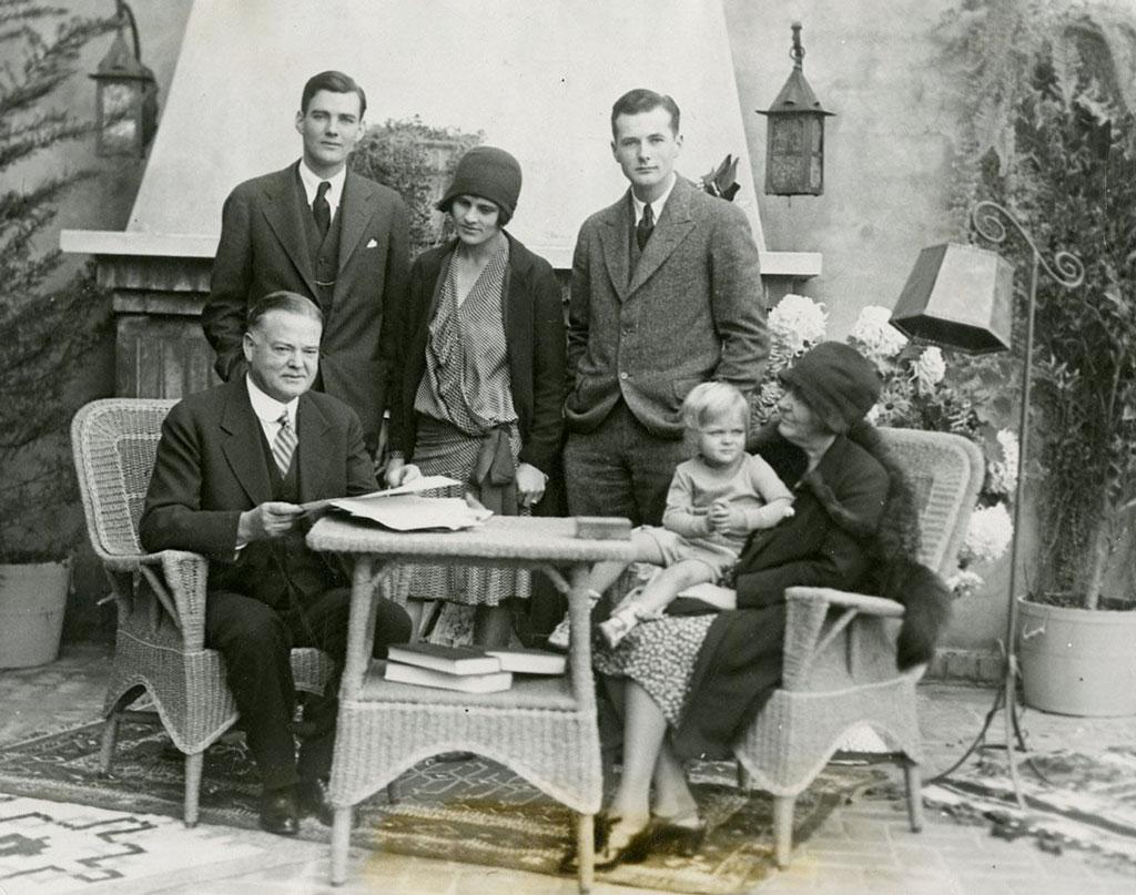 The Hoover family reading early election returns at their Palo Alto home on Stanford campus in CA. 11/06/1928