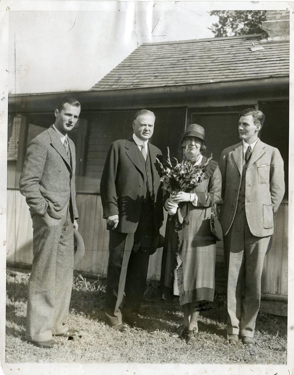 The Hoover family, Herbert Jr., Herbert, Lou and Allan, visit the birth place of Herbert Hoover in West Branch, IA.