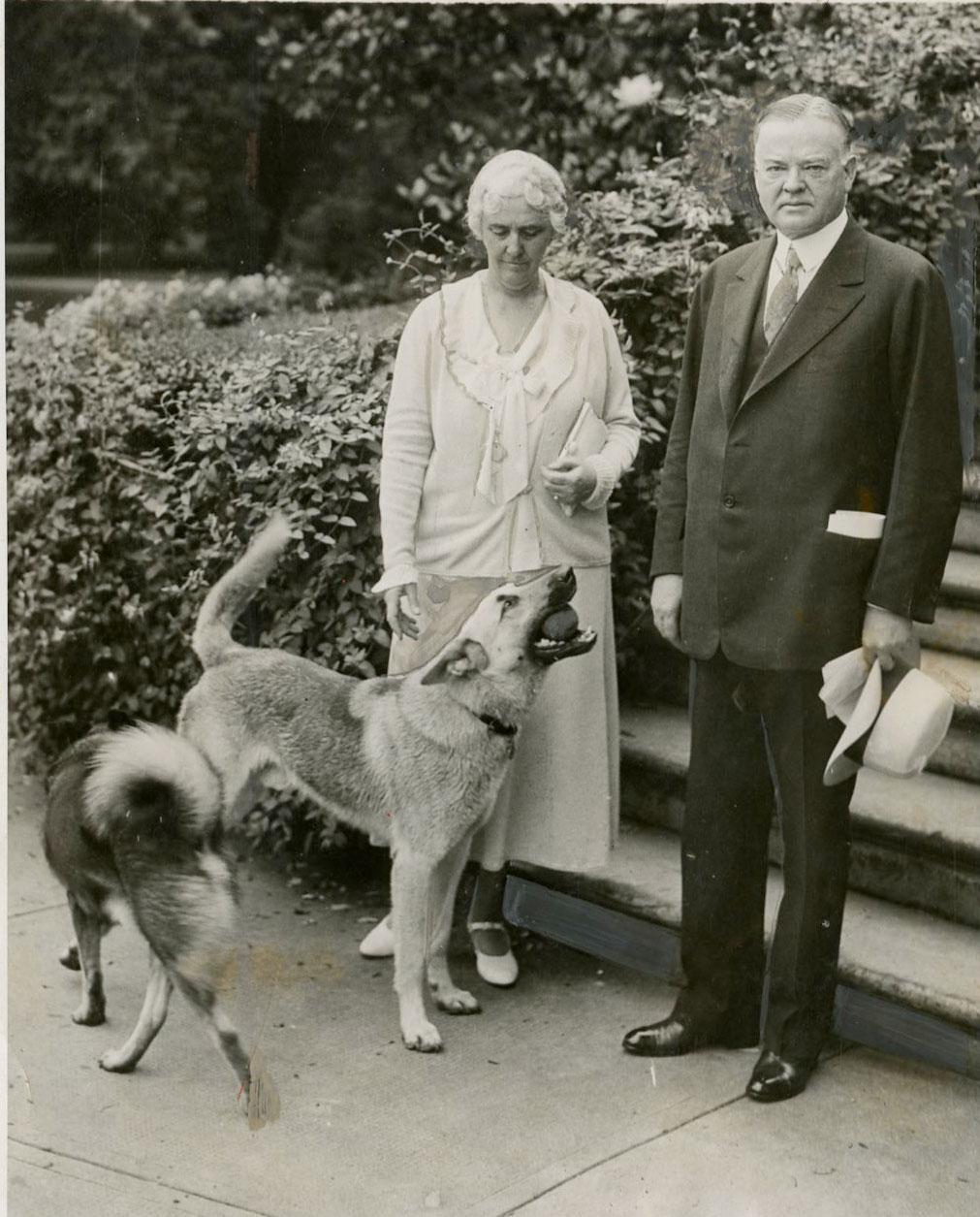 President and Lou Hoover in the White House gardens with Pat and Weegie (Weegie has the ball). 06/15/1932