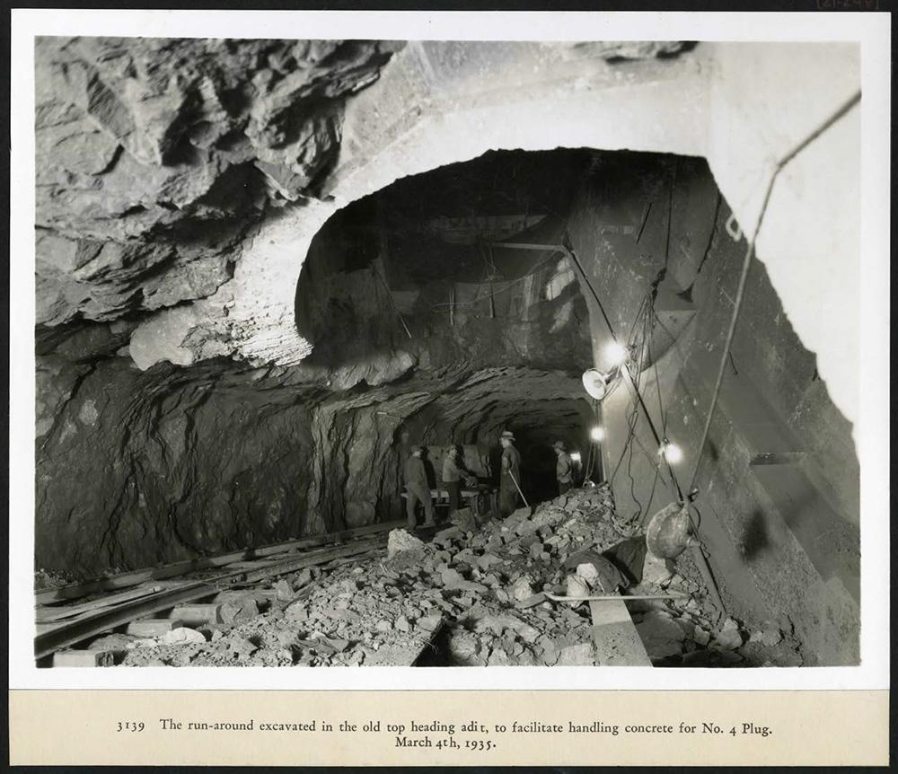 The run-around, excavated in the old top heading adit, to facilitate handling concrete  for No. 4 Plug. 03/04/1935