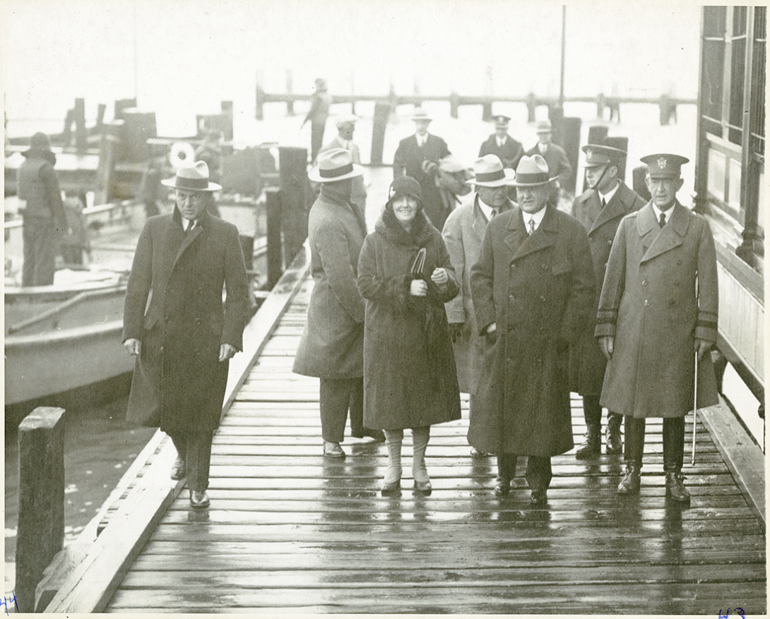 Lou and Herbert Hoover stepping off the USS Utah in Old Point Comfort, VA. January 1929