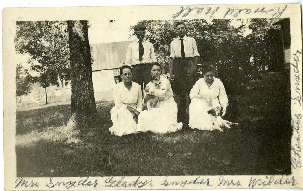 Mrs. Wilder (Laura Ingalls) on the bottom right, with friends at Rocky Ridge Farm, ca. 1915. Other women are: Mrs. Snyder, Gladys Snyder and men are Ronald Hall and Chester Snyder.