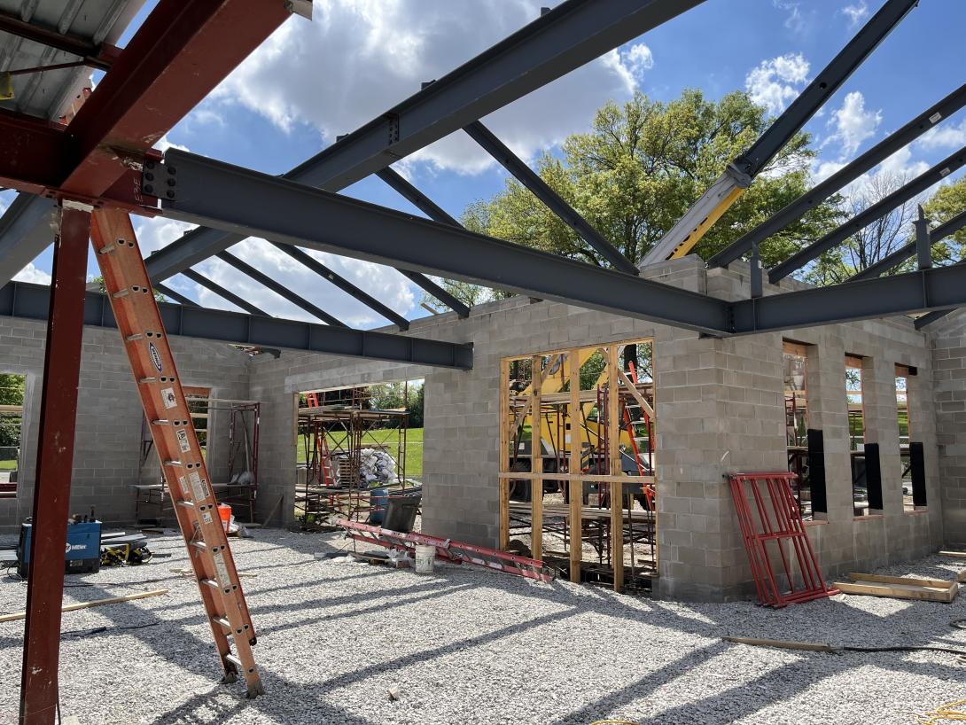 Trusses supporting roof beam and framing of new entrance