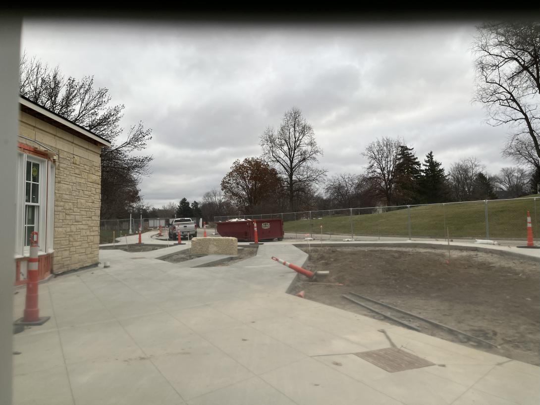 Newly poured concrete for sidewalks in front of the Museum, November 26, 2025