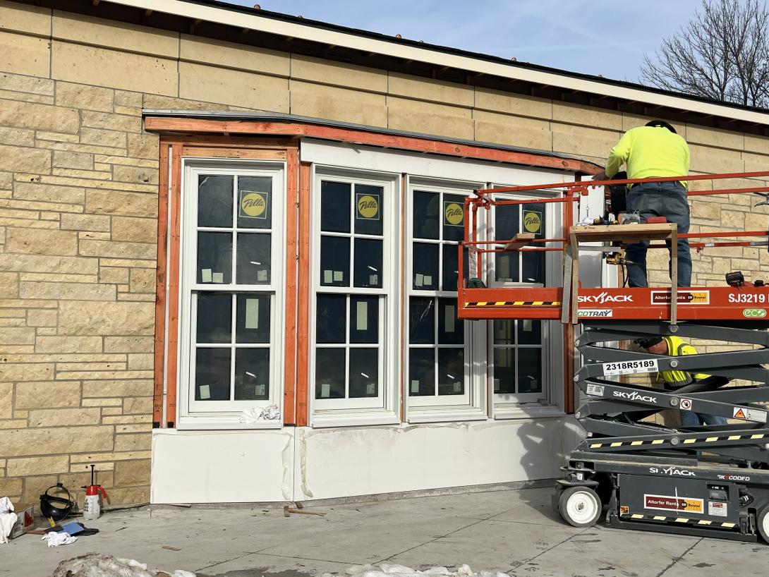 Worker installs trim around new bay window, January 23, 2025