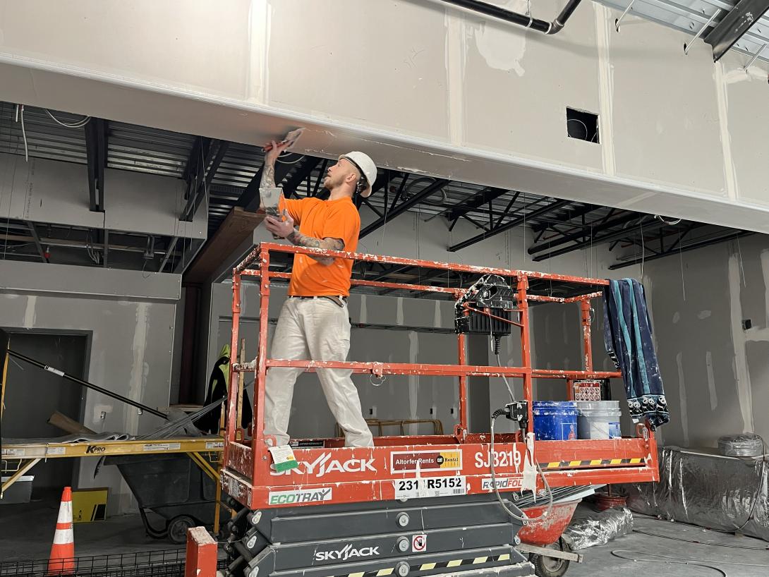 Working finishing drywall in Museum gift shop, January 7, 2026