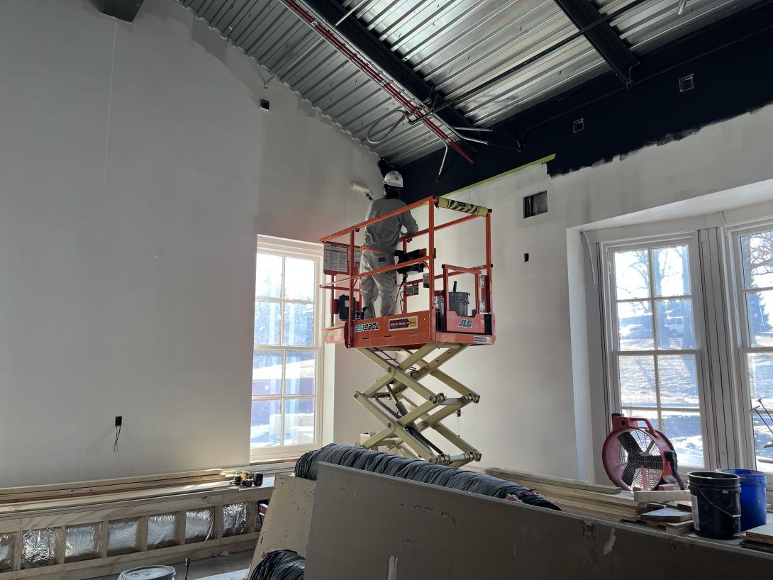 Worker painting in new Museum Gift Shop, February 4, 2026