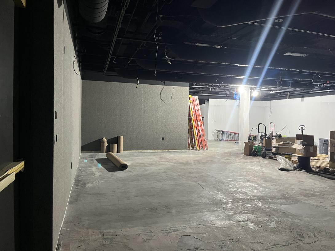 Wall covering being installed in Temporary Exhibit gallery, March 9, 2026