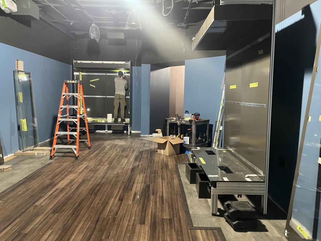 Exhibit cases being installed in Museum gallery, March 11, 2026
