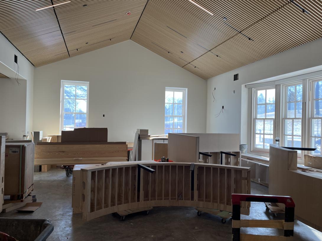 Completed ceiling over the gift shop and construction of reception desk, March 18, 2026