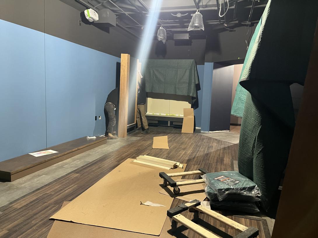 Workers installing artifact display cases in Museum gallery, March 18, 2026