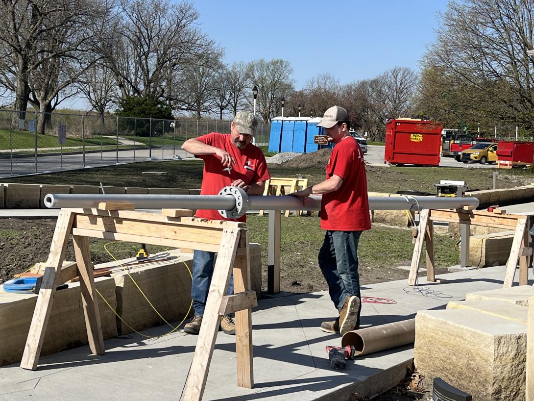 Workers prepare new flagpole, April 22, 2026