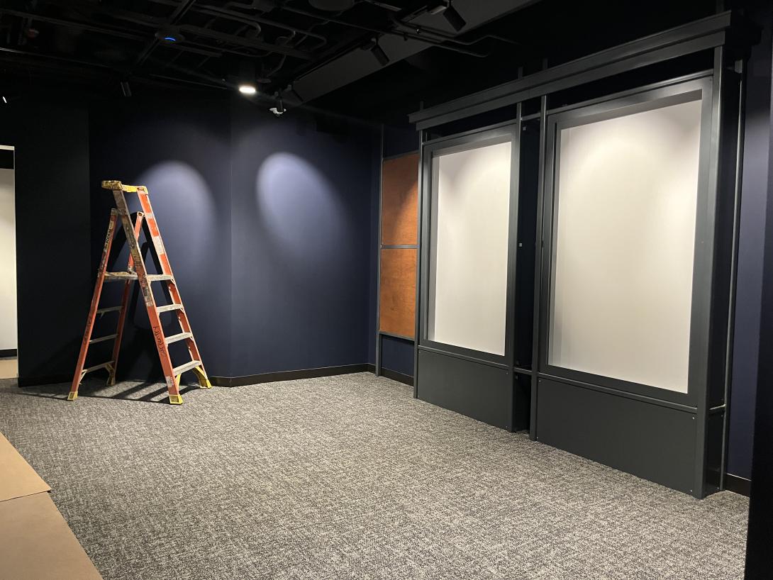 Installing framework in new "Uncommon Iowans" gallery, April 29, 2026