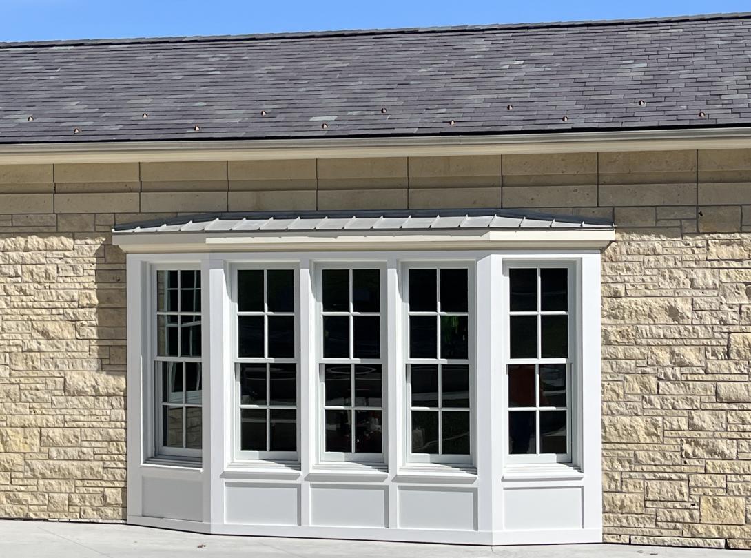 Exterior view of new bay window with trim work completed, May 6, 2026