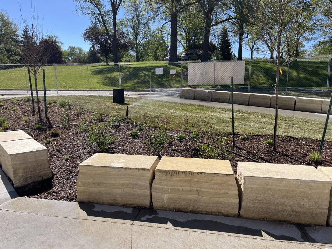 Newly planted trees and grass adorn the spaces in front of the Museum, May 13, 2026