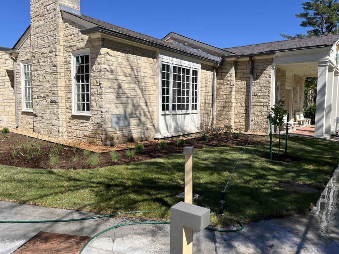 Newly planted trees and grass adorn the spaces in front of the Museum, May 13, 2026