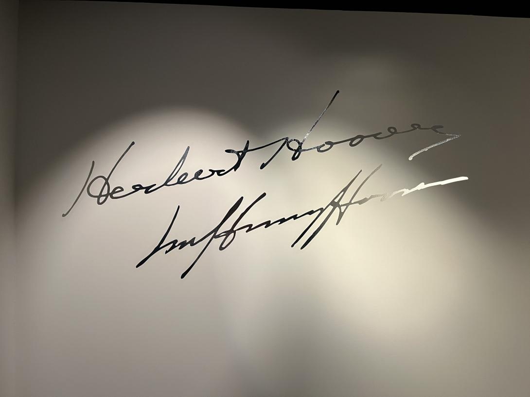Signatures of Herbert and Lou Henry Hoover on the wall at the end of the "Years of Service," June 30, 2026