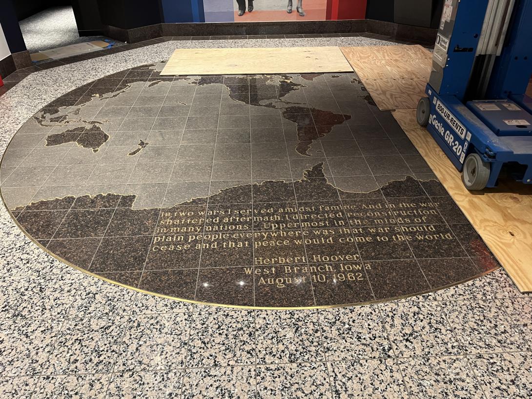 Marble world map uncovered after construction to welcome visitors to the new Story Hub, July 15, 2026
