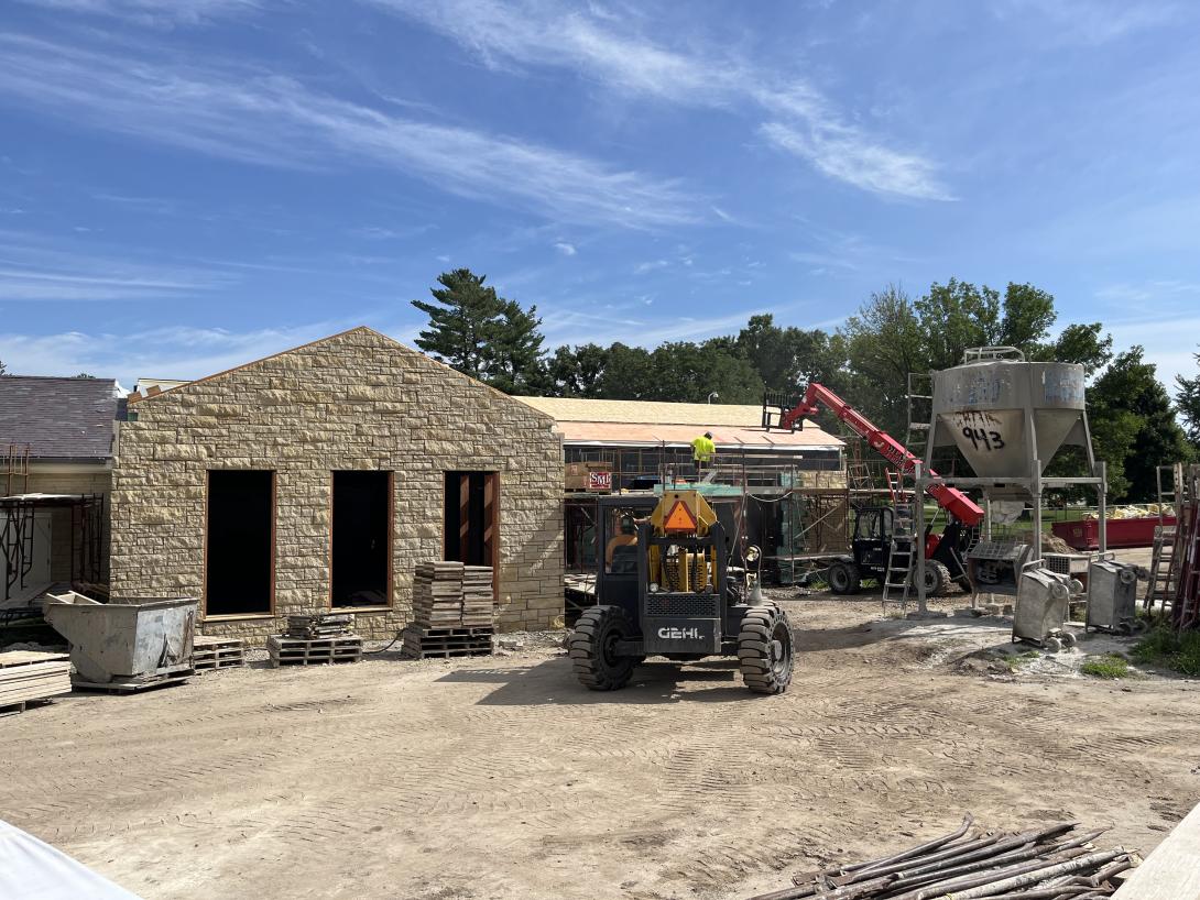 Work crew installing roof insulation, July 2, 2025