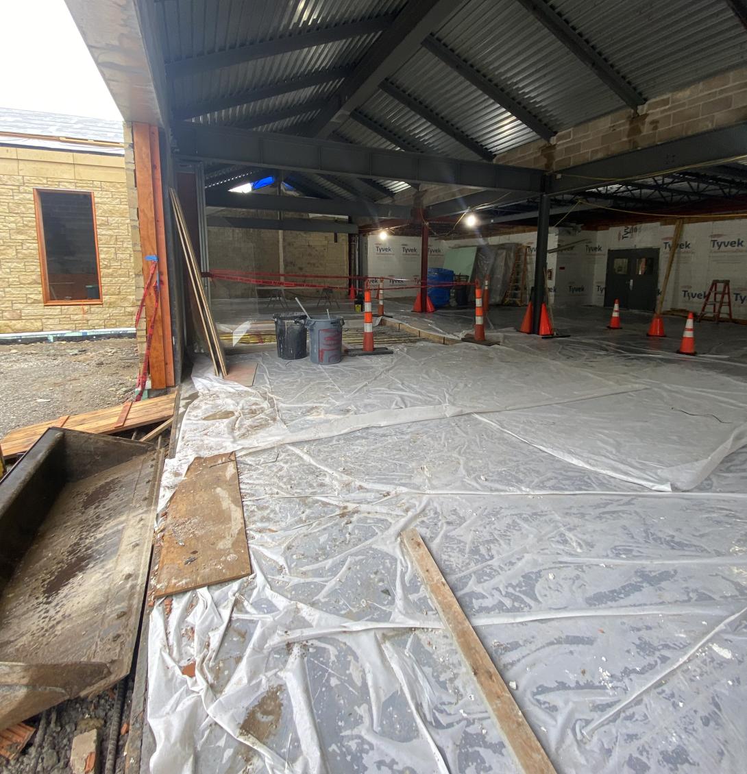 Freshly poured concrete floor for Museum expansion, July 30, 2025