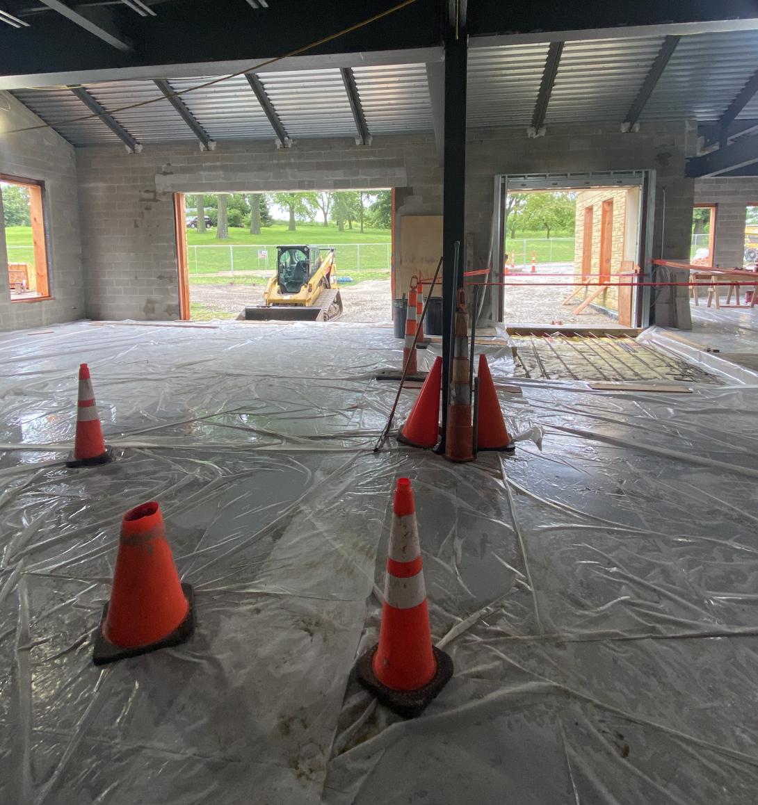 Freshly poured concrete floor for Museum expansion, July 30, 2025
