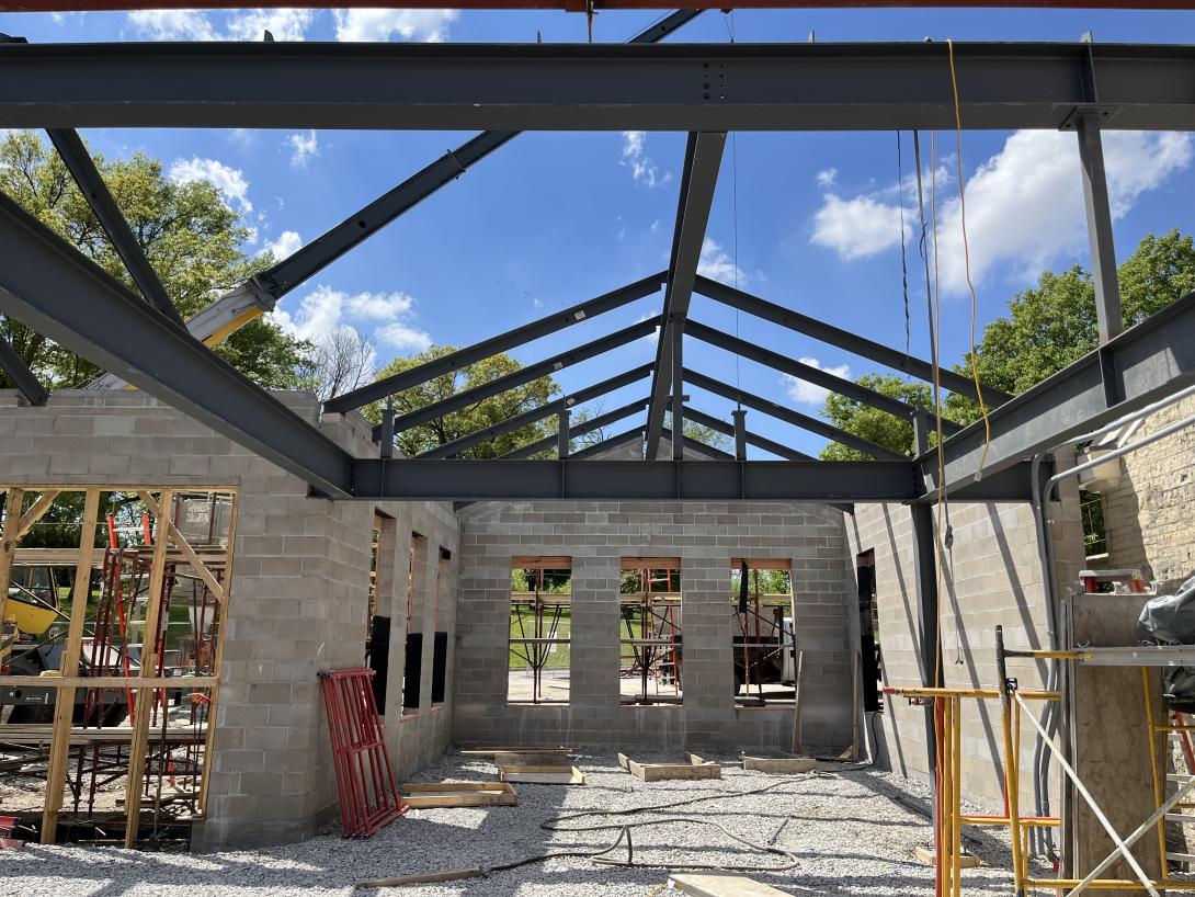 Trusses supporting roof beam for new lobby area