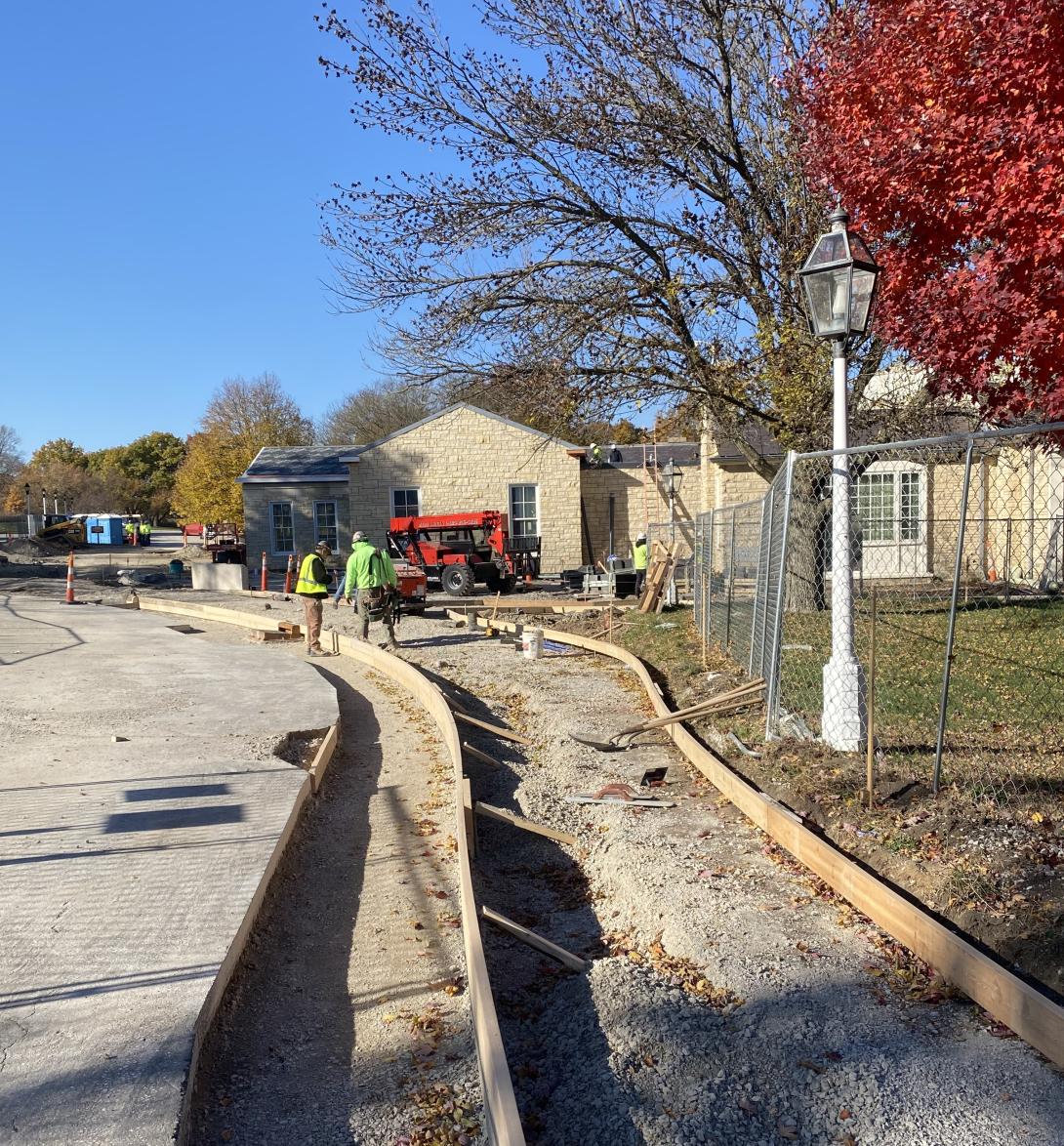 Fresh concrete forms curve into pathways to new Museum entrance, November 5, 2025
